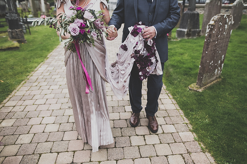 Tara wore a pleated dress in silk with a floral veil for her beautiful coastal wedding at Cushendall Golf Club in Northern Ireland. Photography by Mary McQuillan.