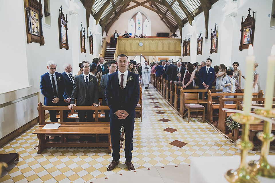 Tara wore a pleated dress in silk with a floral veil for her beautiful coastal wedding at Cushendall Golf Club in Northern Ireland. Photography by Mary McQuillan.