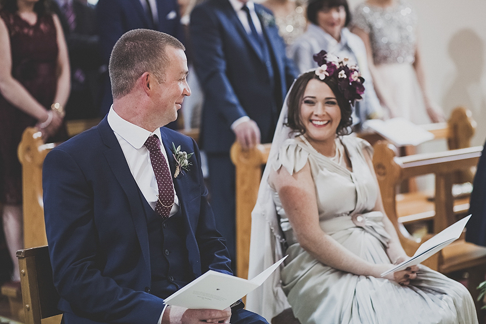 Tara wore a pleated dress in silk with a floral veil for her beautiful coastal wedding at Cushendall Golf Club in Northern Ireland. Photography by Mary McQuillan.