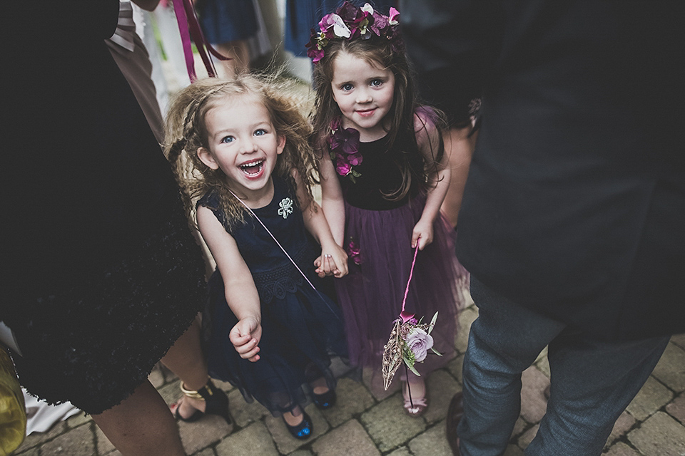 Tara wore a pleated dress in silk with a floral veil for her beautiful coastal wedding at Cushendall Golf Club in Northern Ireland. Photography by Mary McQuillan.