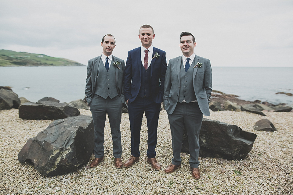 Tara wore a pleated dress in silk with a floral veil for her beautiful coastal wedding at Cushendall Golf Club in Northern Ireland. Photography by Mary McQuillan.