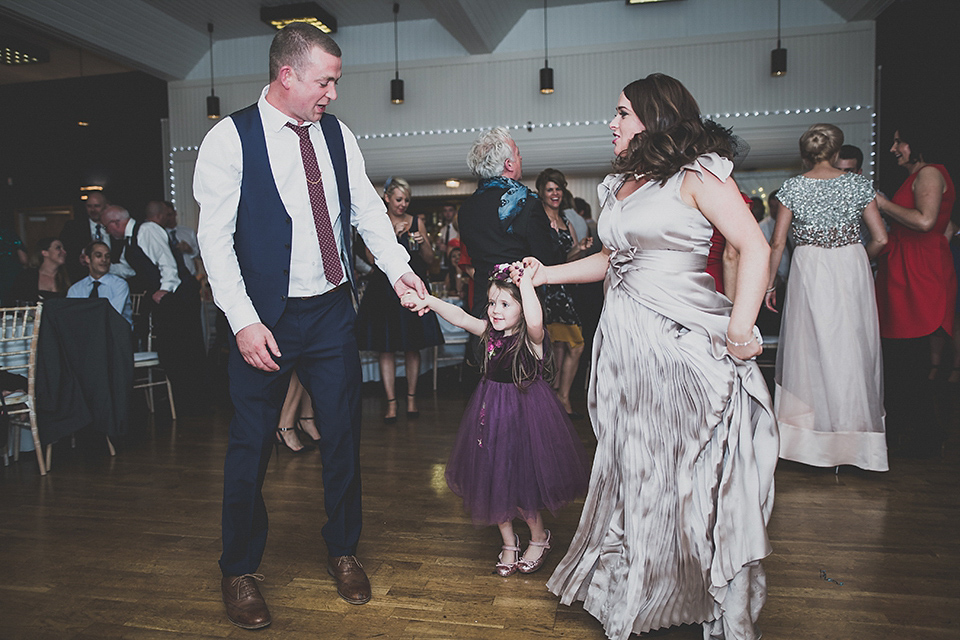 Tara wore a pleated dress in silk with a floral veil for her beautiful coastal wedding at Cushendall Golf Club in Northern Ireland. Photography by Mary McQuillan.