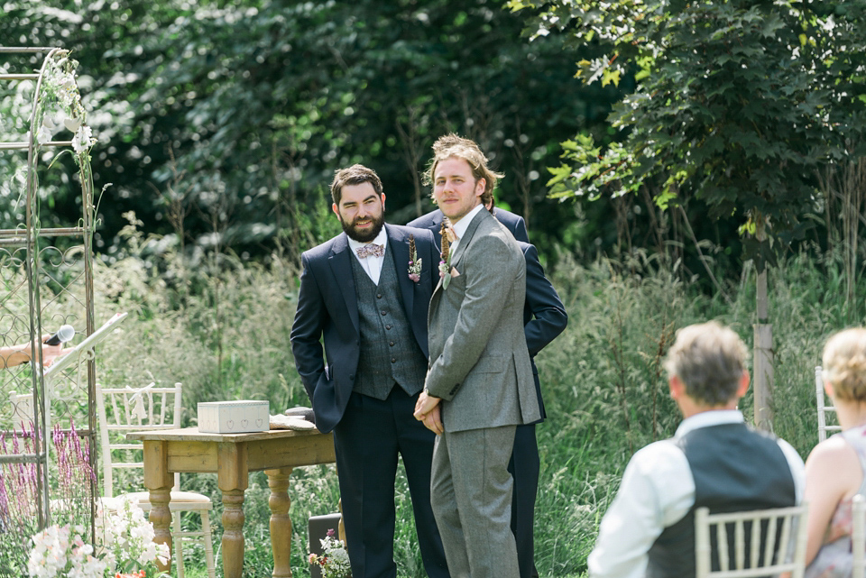 Bride Emma wore Eden by Jenny Packham, a fishtail plait and flowers in her hair for her ourdoor wedding at Baxby Manor. Photography by Sarah Folega.