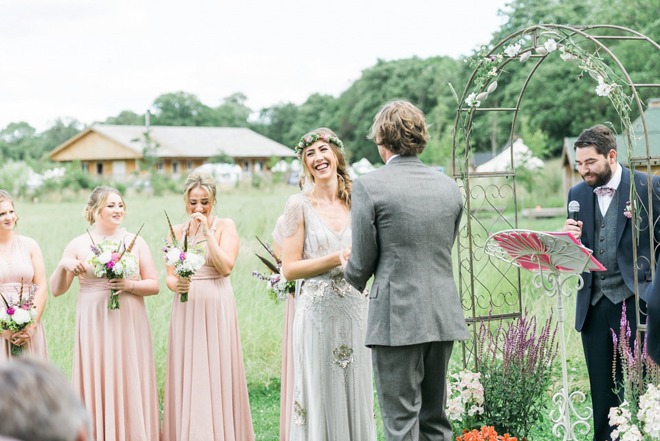 Bride Emma wore Eden by Jenny Packham, a fishtail plait and flowers in her hair for her ourdoor wedding at Baxby Manor. Photography by Sarah Folega.