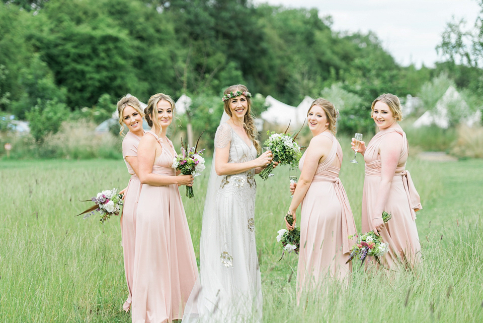 Bride Emma wore Eden by Jenny Packham, a fishtail plait and flowers in her hair for her ourdoor wedding at Baxby Manor. Photography by Sarah Folega.