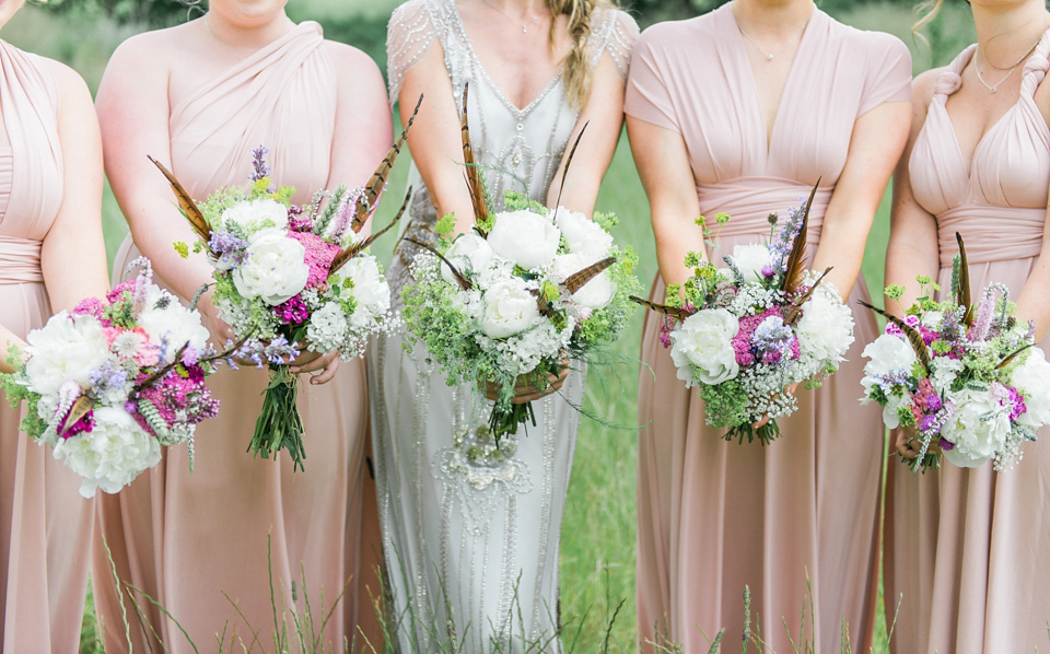 Bride Emma wore Eden by Jenny Packham, a fishtail plait and flowers in her hair for her ourdoor wedding at Baxby Manor. Photography by Sarah Folega.