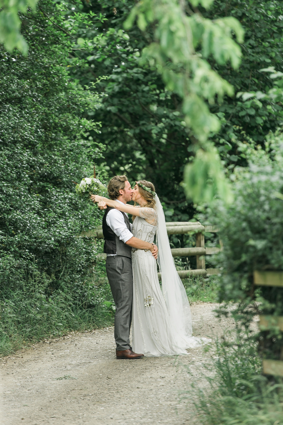 Bride Emma wore Eden by Jenny Packham, a fishtail plait and flowers in her hair for her ourdoor wedding at Baxby Manor. Photography by Sarah Folega.