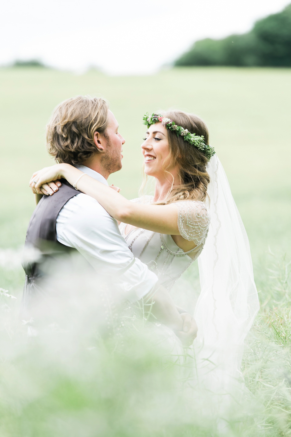 Bride Emma wore Eden by Jenny Packham, a fishtail plait and flowers in her hair for her ourdoor wedding at Baxby Manor. Photography by Sarah Folega.