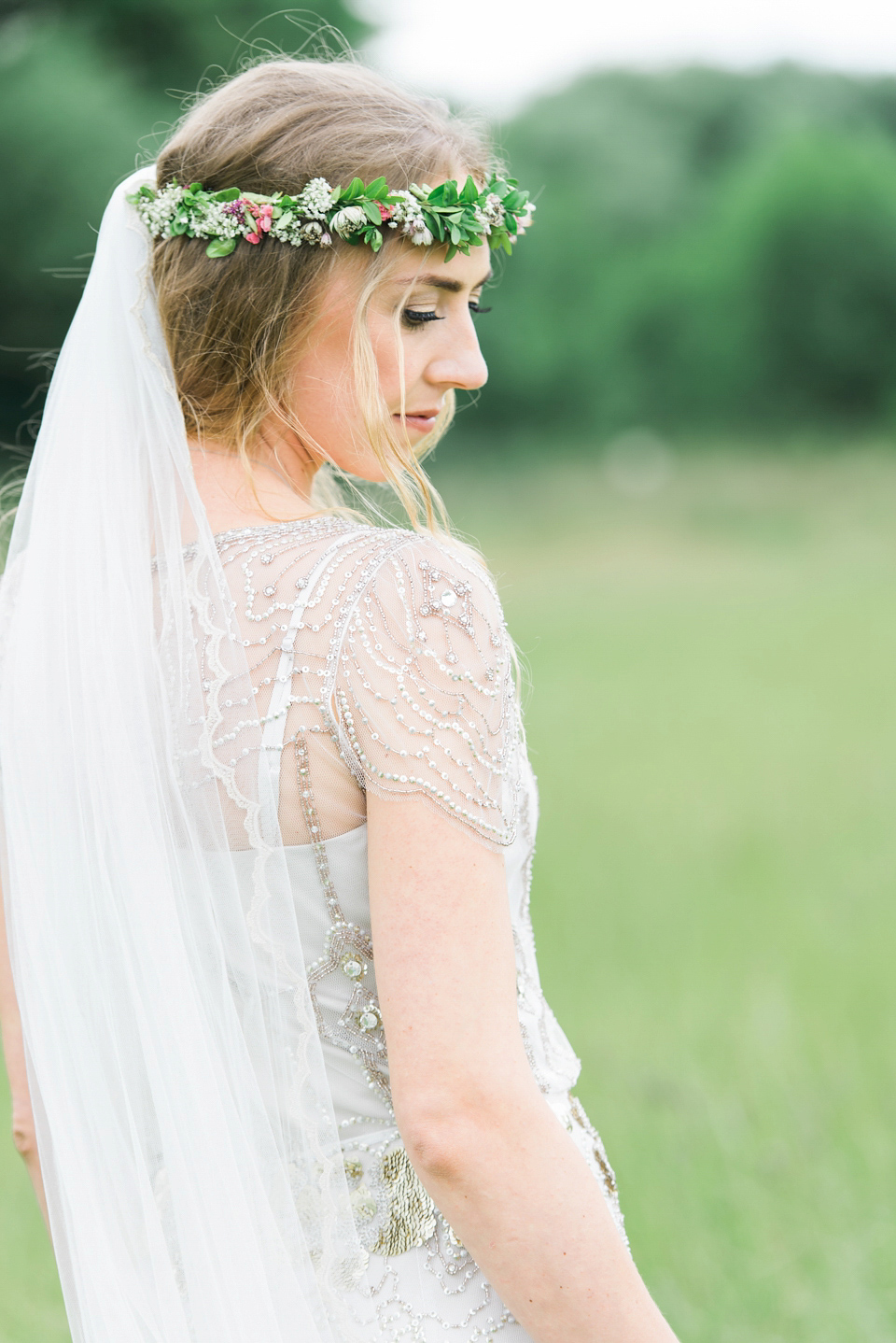 Bride Emma wore Eden by Jenny Packham, a fishtail plait and flowers in her hair for her ourdoor wedding at Baxby Manor. Photography by Sarah Folega.