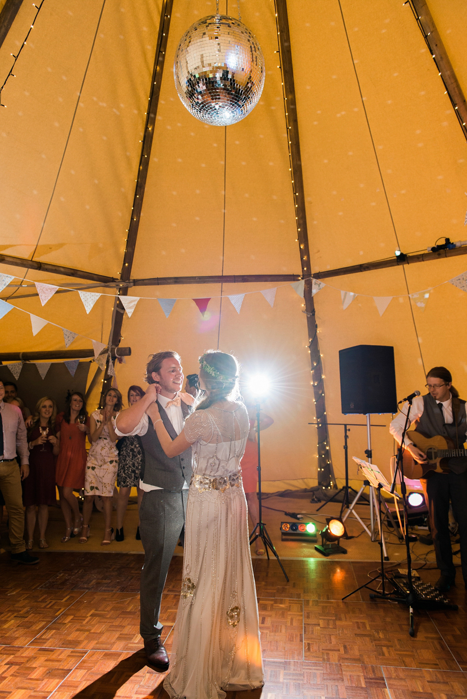 Bride Emma wore Eden by Jenny Packham, a fishtail plait and flowers in her hair for her ourdoor wedding at Baxby Manor. Photography by Sarah Folega.