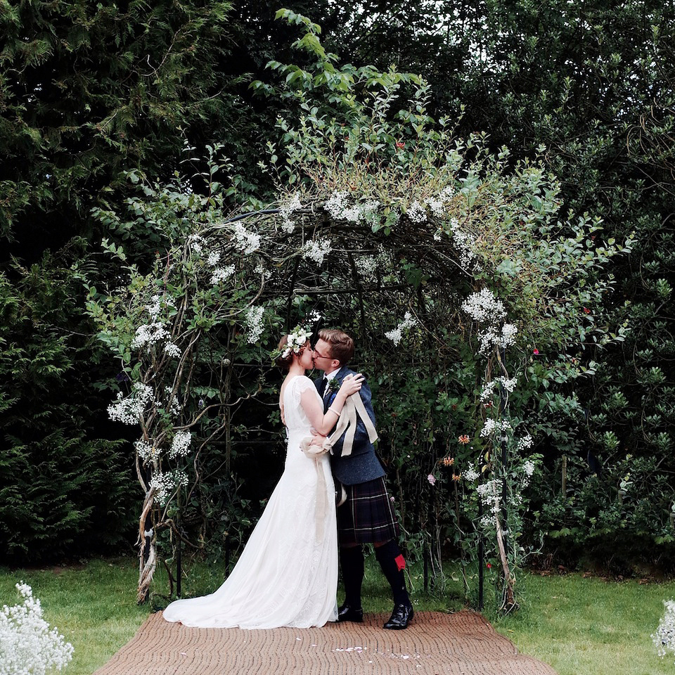 Bride Amy wears a Belle & Bunty Gown for her pretty rustic wedding with 1000 paper cranes. She and her husband David met via the Guardian Soulmates online dating site.