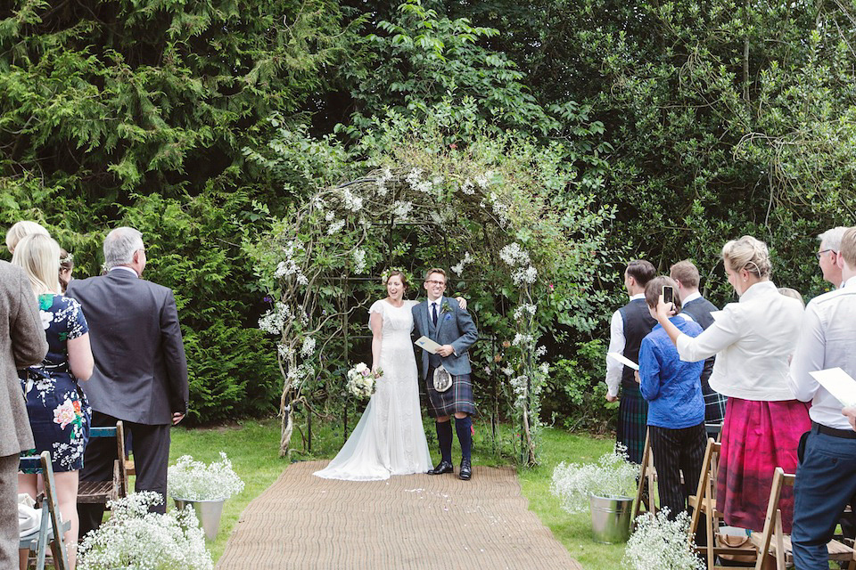 Bride Amy wears a Belle & Bunty Gown for her pretty rustic wedding with 1000 paper cranes. She and her husband David met via the Guardian Soulmates online dating site.