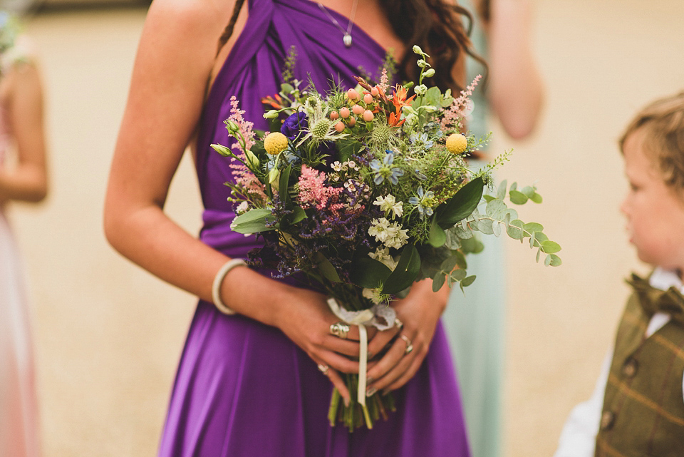 A bright and colourful, English country wedding held in the open air at a moated Tudor Hall. Photography by Matt Penberthy.