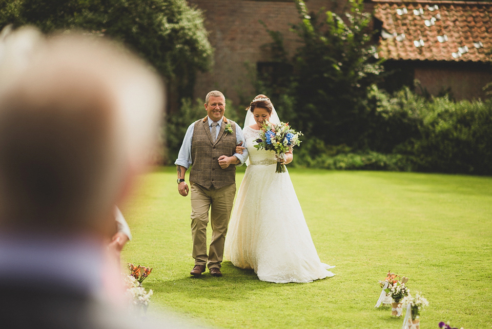 A bright and colourful, English country wedding held in the open air at a moated Tudor Hall. Photography by Matt Penberthy.