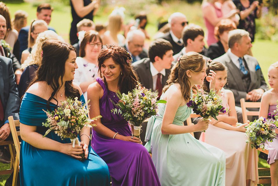 A bright and colourful, English country wedding held in the open air at a moated Tudor Hall. Photography by Matt Penberthy.