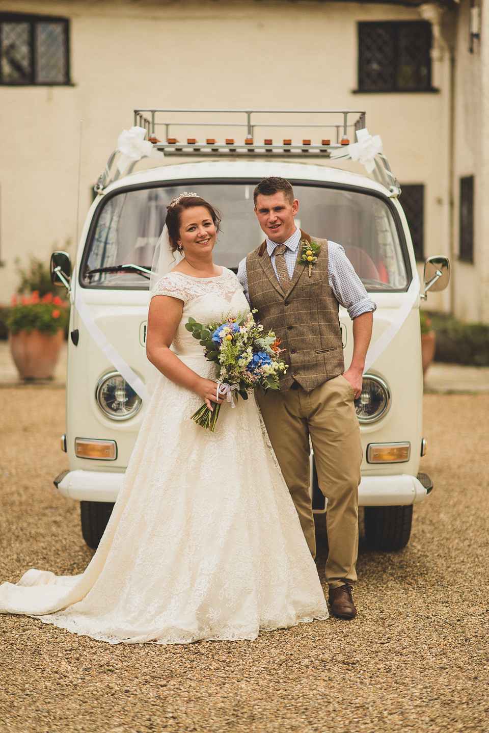 A bright and colourful, English country wedding held in the open air at a moated Tudor Hall. Photography by Matt Penberthy.