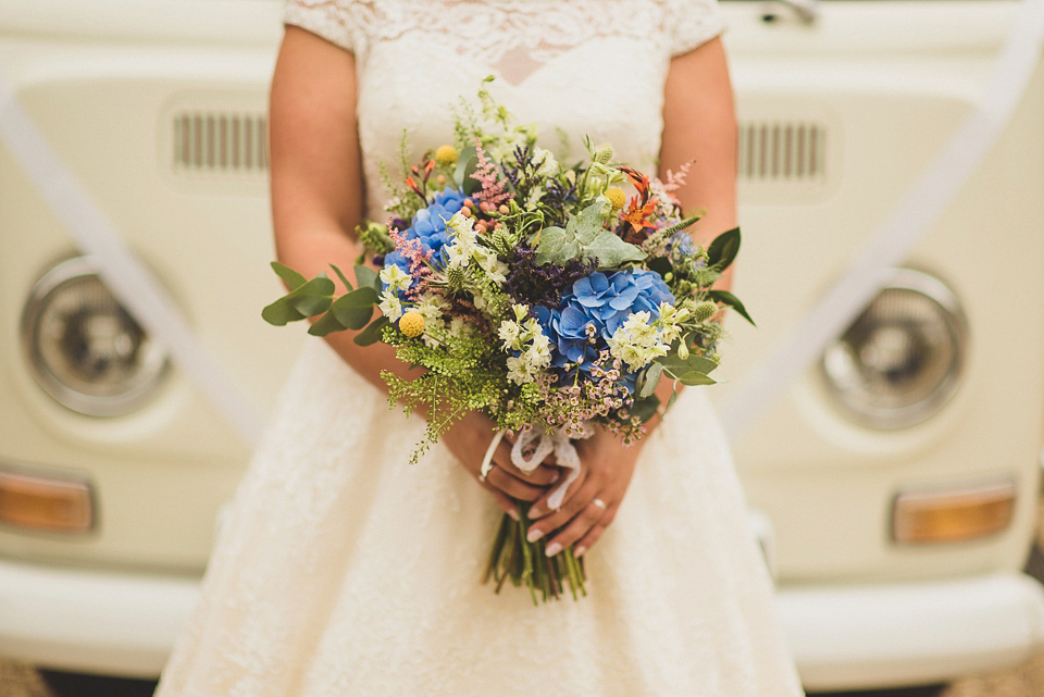 A bright and colourful, English country wedding held in the open air at a moated Tudor Hall. Photography by Matt Penberthy.