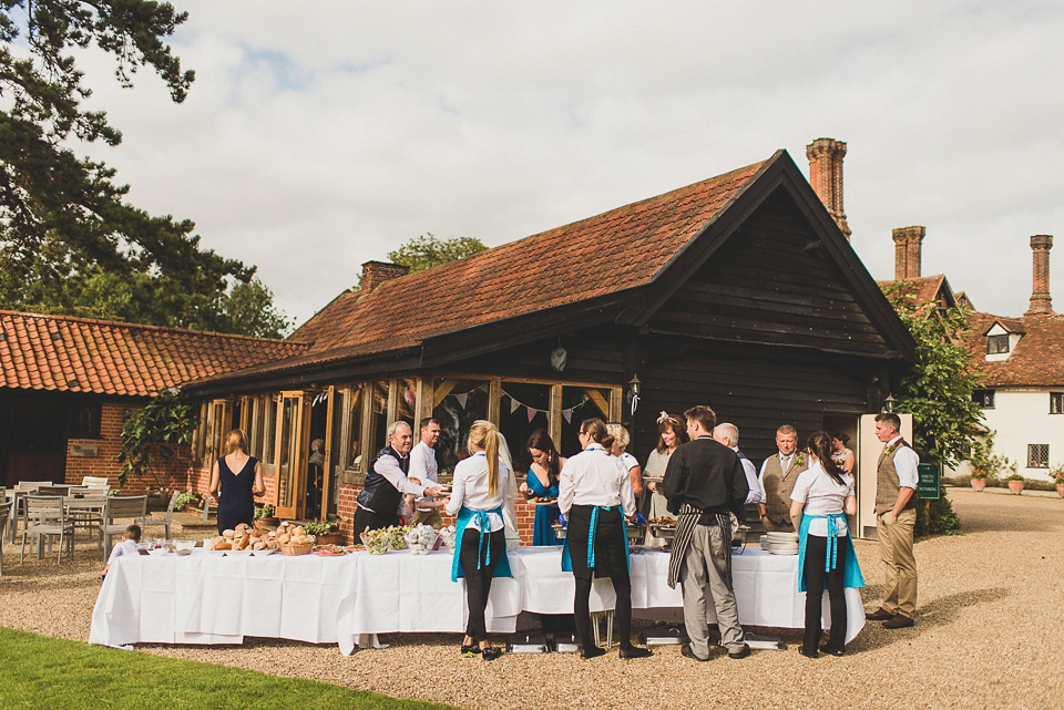 A bright and colourful, English country wedding held in the open air at a moated Tudor Hall. Photography by Matt Penberthy.