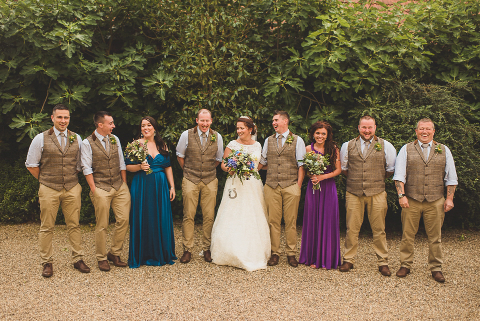 A bright and colourful, English country wedding held in the open air at a moated Tudor Hall. Photography by Matt Penberthy.