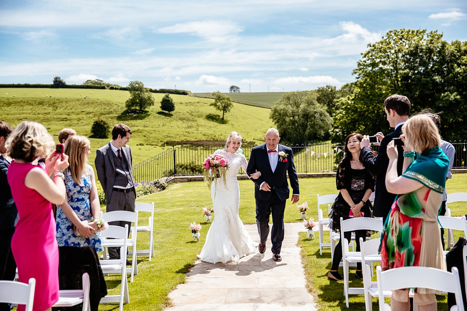 Lucy wore an Ellis Bridals gown for her quirky and colourful outdoor wedding. Photography by Cassandra Lane.