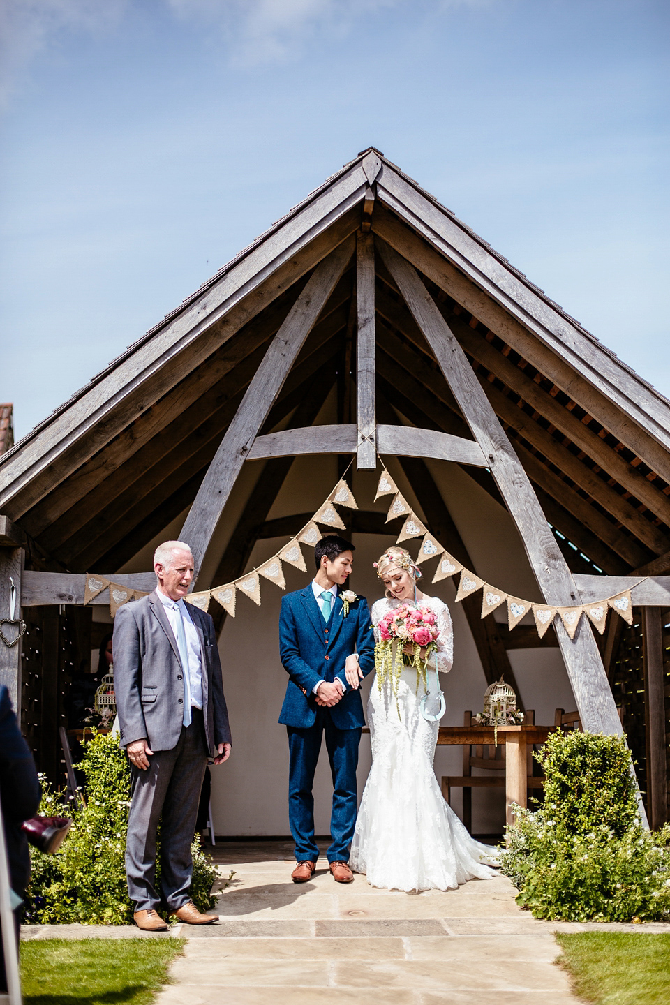 Lucy wore an Ellis Bridals gown for her quirky and colourful outdoor wedding. Photography by Cassandra Lane.