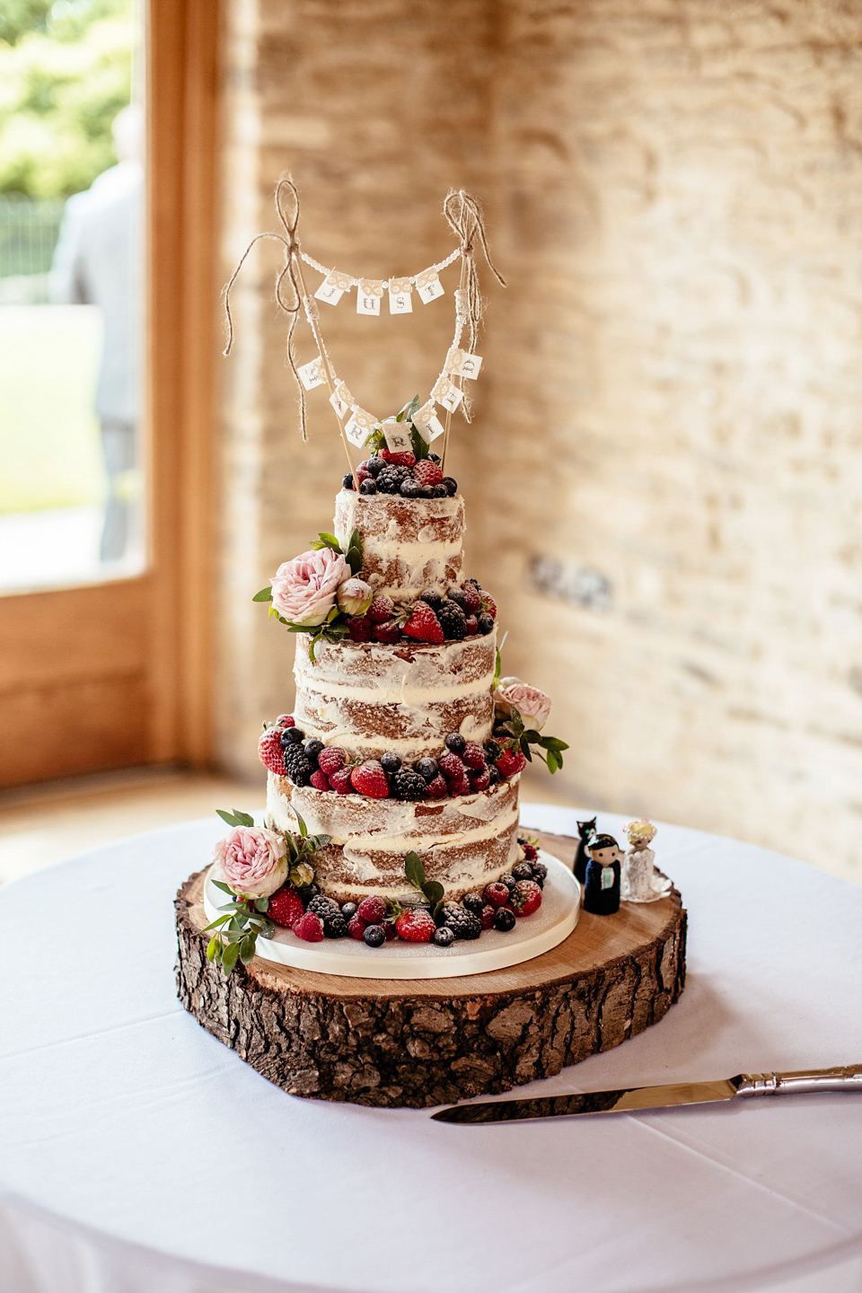 Lucy wore an Ellis Bridals gown for her quirky and colourful outdoor wedding. Photography by Cassandra Lane.