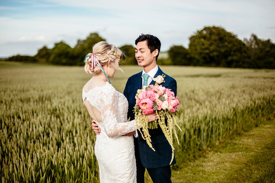 Lucy wore an Ellis Bridals gown for her quirky and colourful outdoor wedding. Photography by Cassandra Lane.