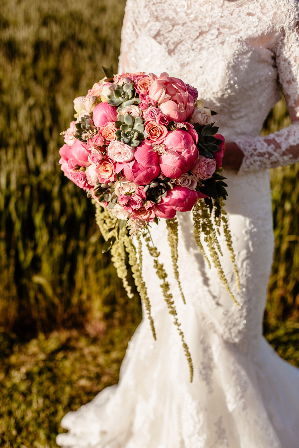 Lucy wore an Ellis Bridals gown for her quirky and colourful outdoor wedding. Photography by Cassandra Lane.