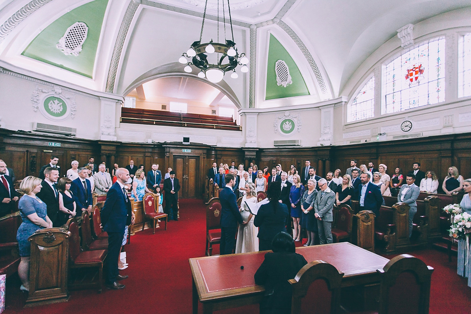 Bride Rosie wore a Belle & Bunty gown for her city wedding. Photography by Tom Biddle.