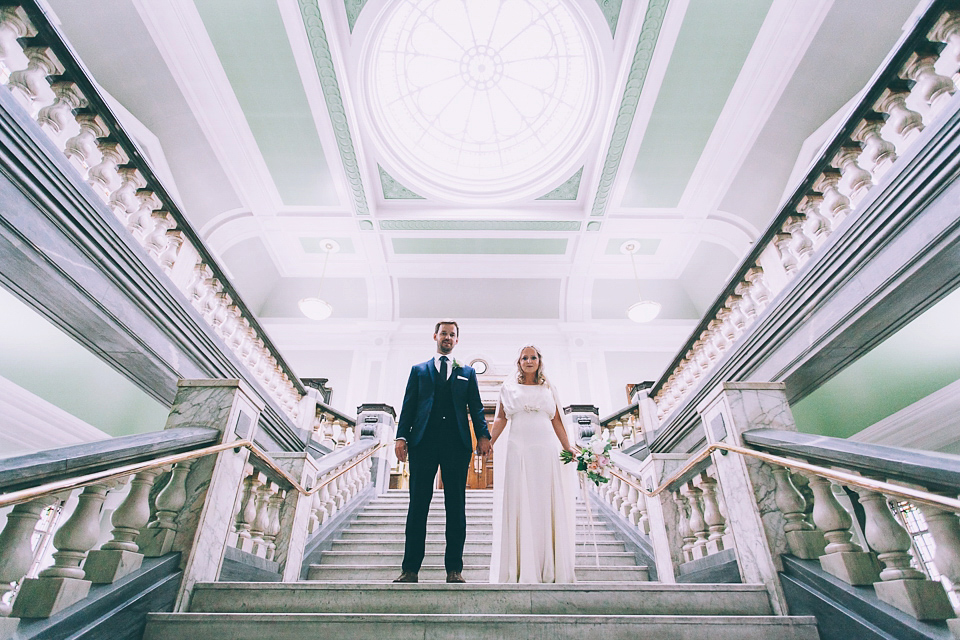 Bride Rosie wore a Belle & Bunty gown for her city wedding. Photography by Tom Biddle.