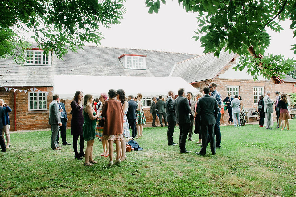 Kat wears Eden by Jenny Packham for her pretty Summer village hall wedding. Photography by Emma B.