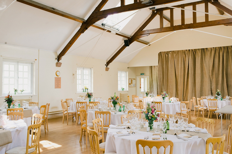 Kat wears Eden by Jenny Packham for her pretty Summer village hall wedding. Photography by Emma B.