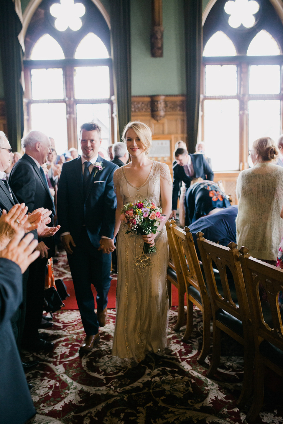 Kat wears Eden by Jenny Packham for her pretty Summer village hall wedding. Photography by Emma B.