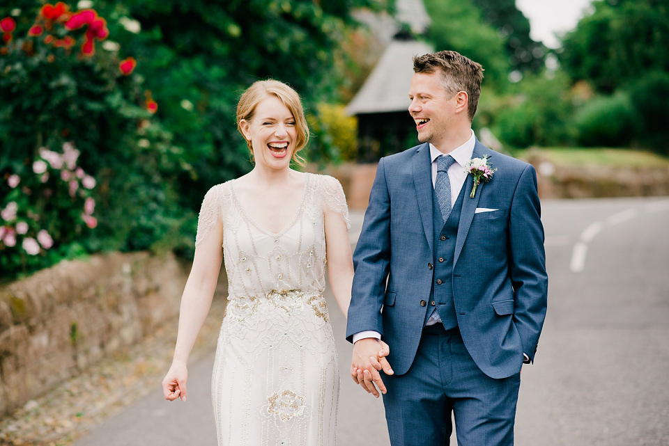 Kat wears Eden by Jenny Packham for her pretty Summer village hall wedding. Photography by Emma B.