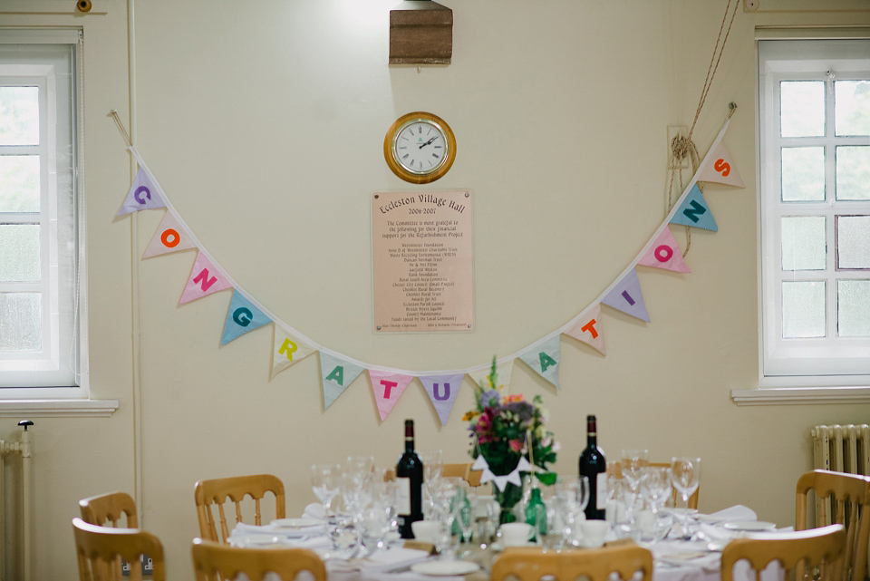 Kat wears Eden by Jenny Packham for her pretty Summer village hall wedding. Photography by Emma B.