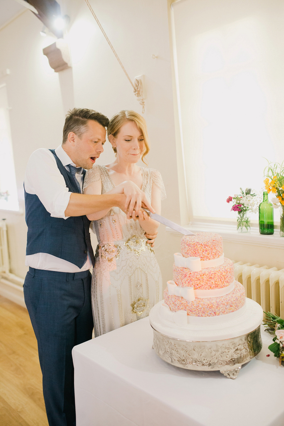 Kat wears Eden by Jenny Packham for her pretty Summer village hall wedding. Photography by Emma B.