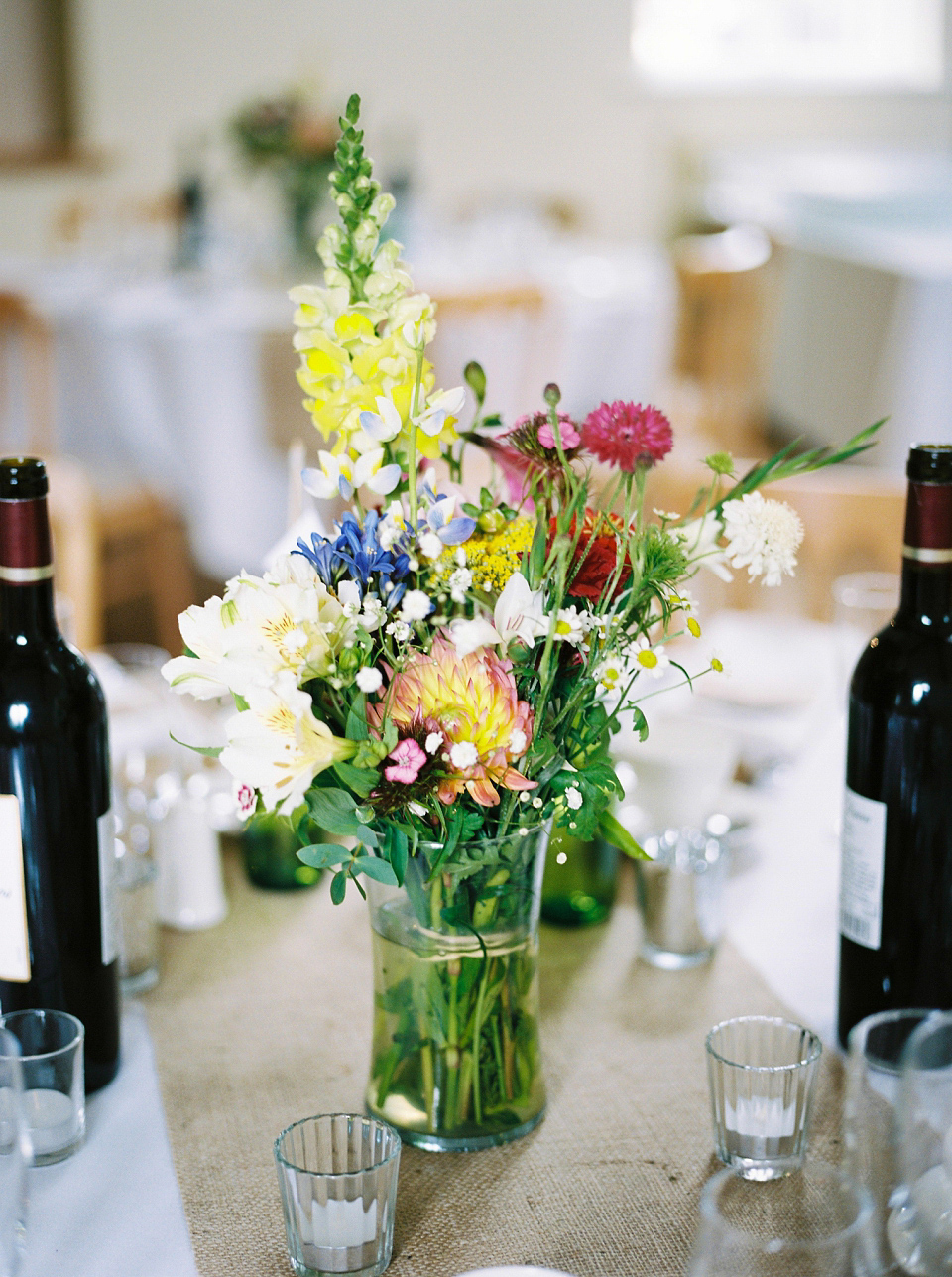 Kat wears Eden by Jenny Packham for her pretty Summer village hall wedding. Photography by Emma B.