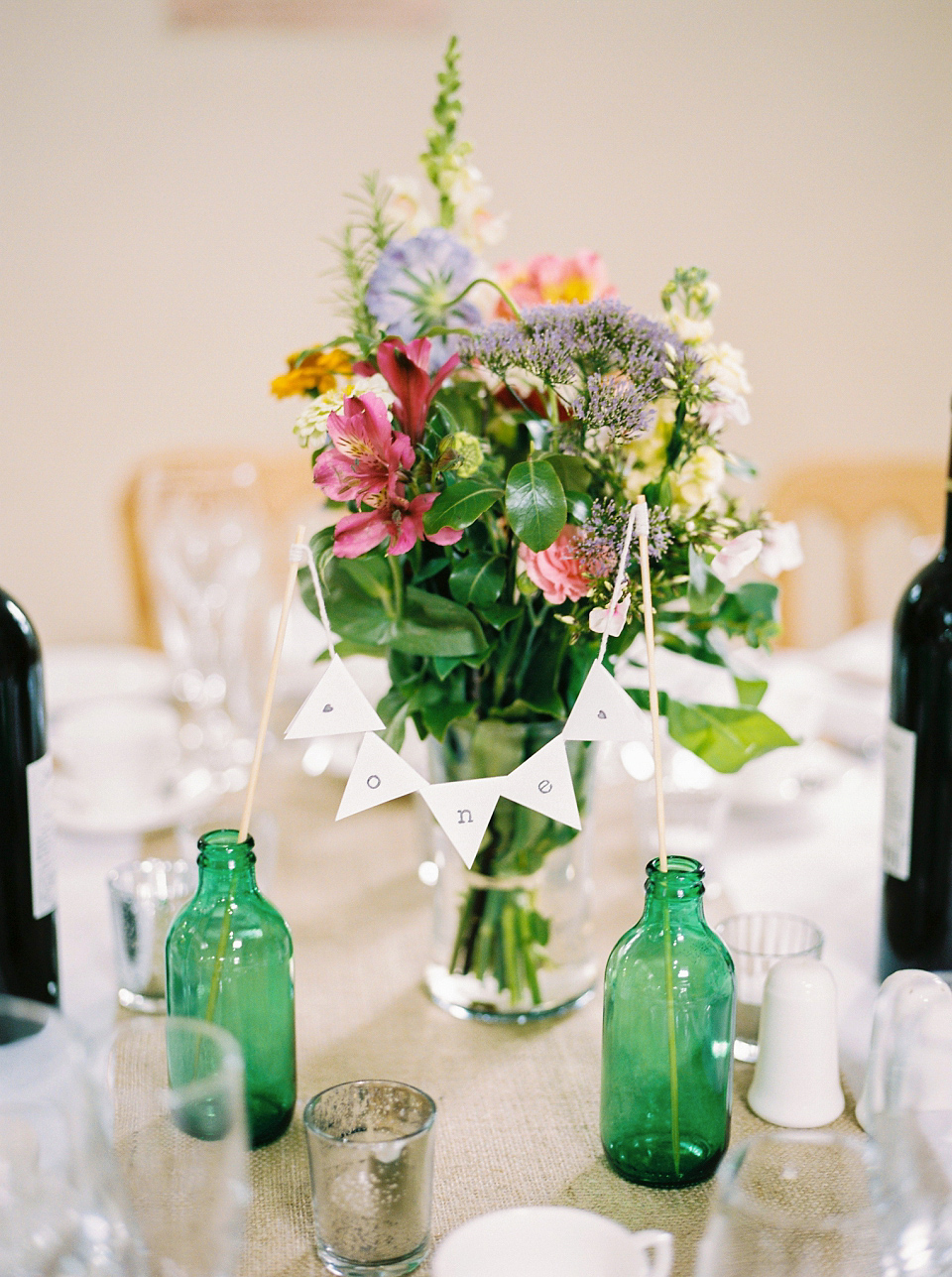 Kat wears Eden by Jenny Packham for her pretty Summer village hall wedding. Photography by Emma B.