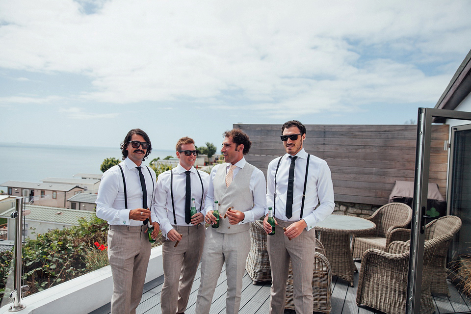Bride Sarah wore an Essence of Australia gown and flowers in her hair for her wedding by the sea in Dorset. Photography by Charlotte Bryer Ash. Bride Sarah wore an Essence of Australia gown and flowers in her hair for her wedding by the sea in Dorset. Photography by Charlotte Bryer Ash.