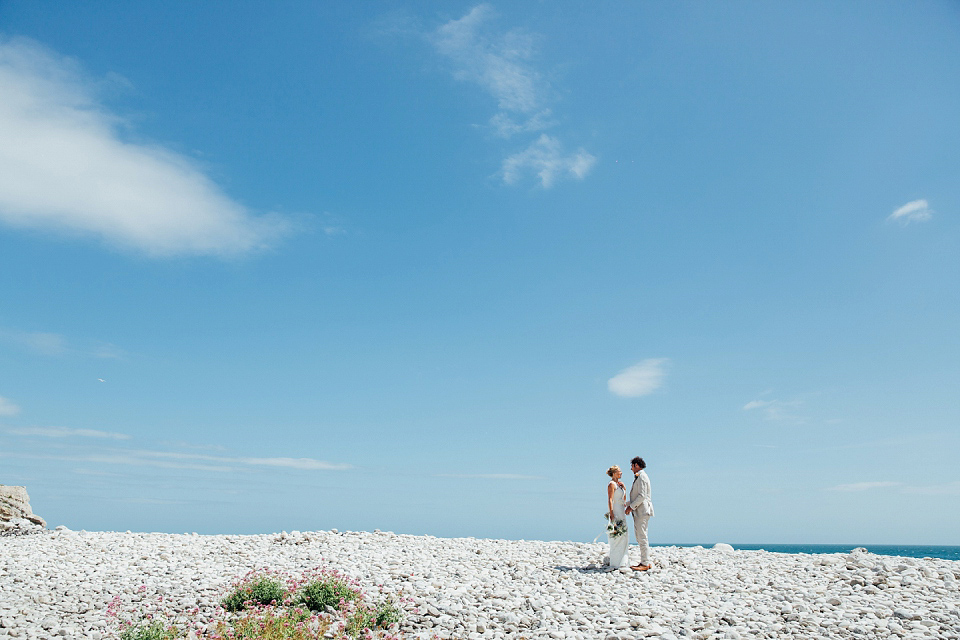 Bride Sarah wore an Essence of Australia gown and flowers in her hair for her wedding by the sea in Dorset. Photography by Charlotte Bryer Ash. Bride Sarah wore an Essence of Australia gown and flowers in her hair for her wedding by the sea in Dorset. Photography by Charlotte Bryer Ash.