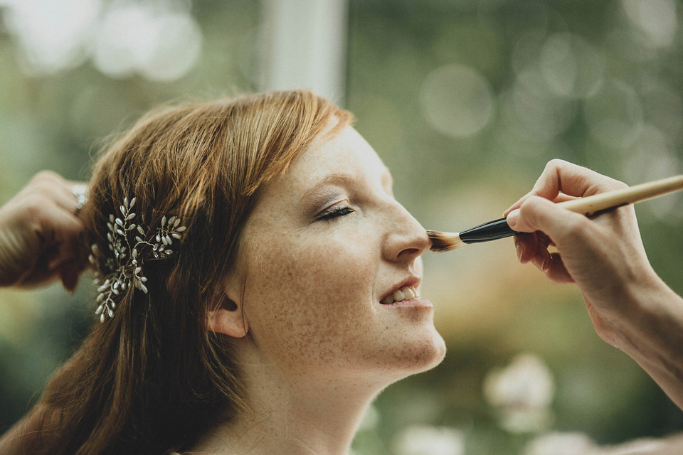 Bride Jess made her wedding dress herself. She tied the knot with Jordan in a woodland inspired wedding. Photography by Ali Paul.