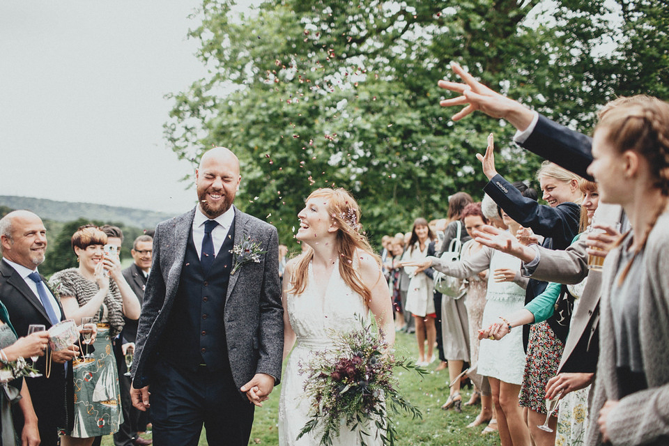 Bride Jess made her wedding dress herself. She tied the knot with Jordan in a woodland inspired wedding. Photography by Ali Paul.