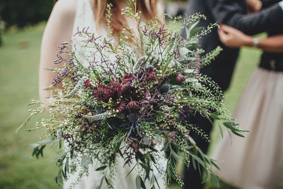 Bride Jess made her wedding dress herself. She tied the knot with Jordan in a woodland inspired wedding. Photography by Ali Paul.