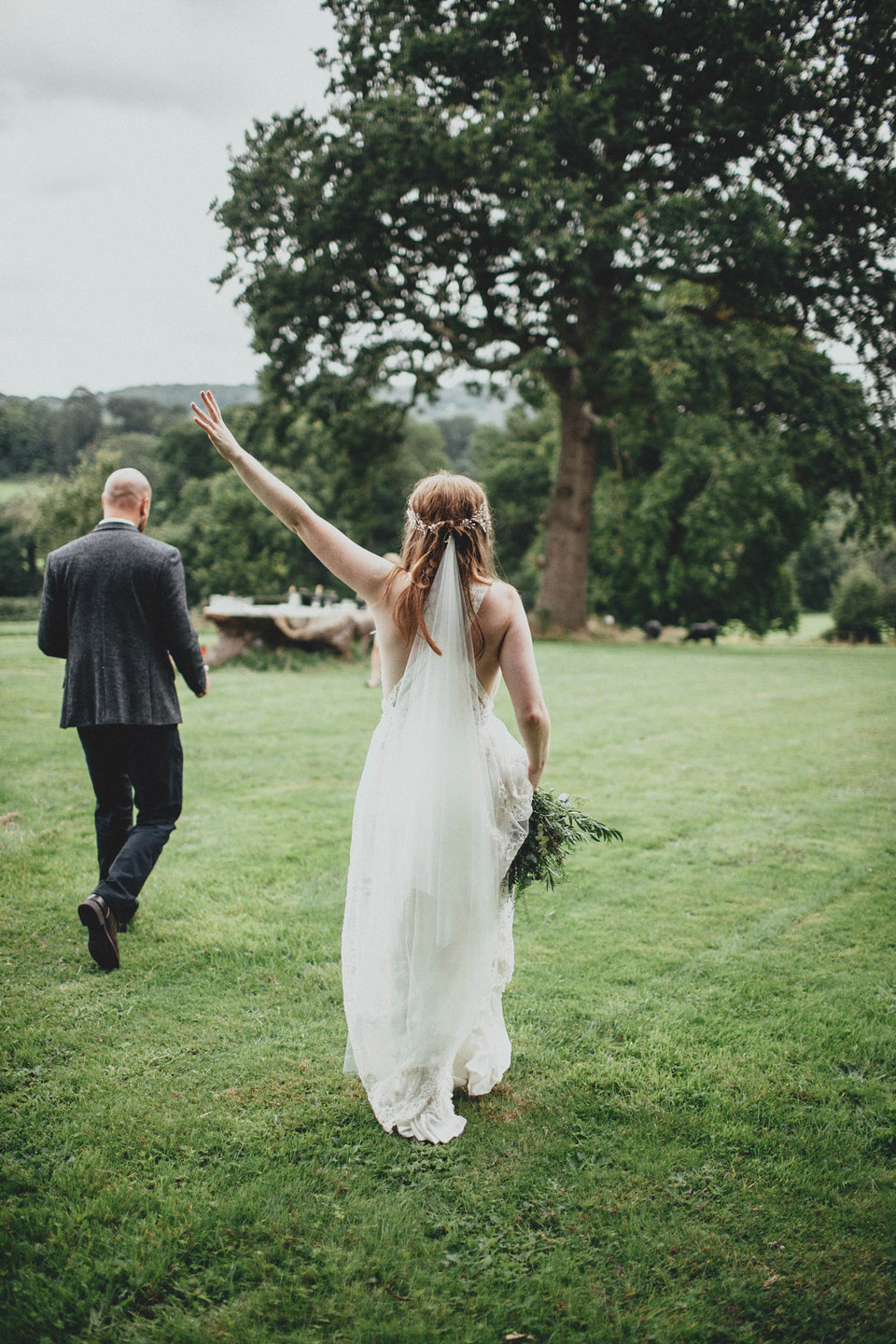 Bride Jess made her wedding dress herself. She tied the knot with Jordan in a woodland inspired wedding. Photography by Ali Paul.