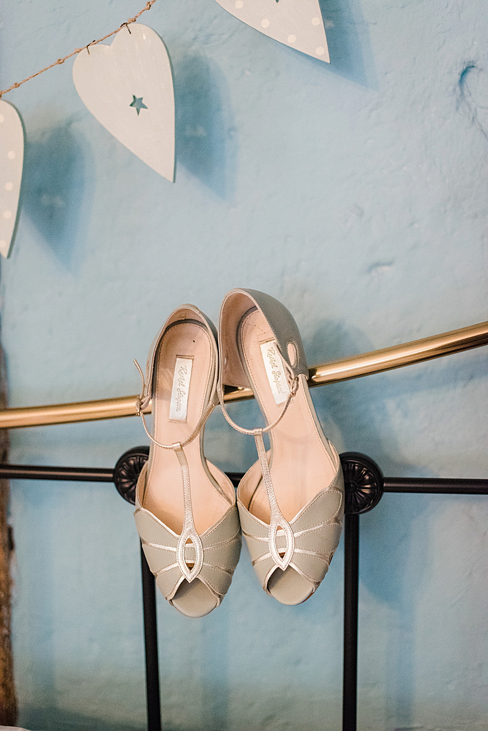 Bride Daisy wore a Stella York gown for her pale blue and flower filled Summer wedding in the English countryside. Photography by Faye Cornhill.