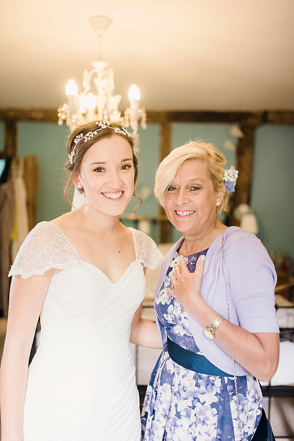 Bride Daisy wore a Stella York gown for her pale blue and flower filled Summer wedding in the English countryside. Photography by Faye Cornhill.