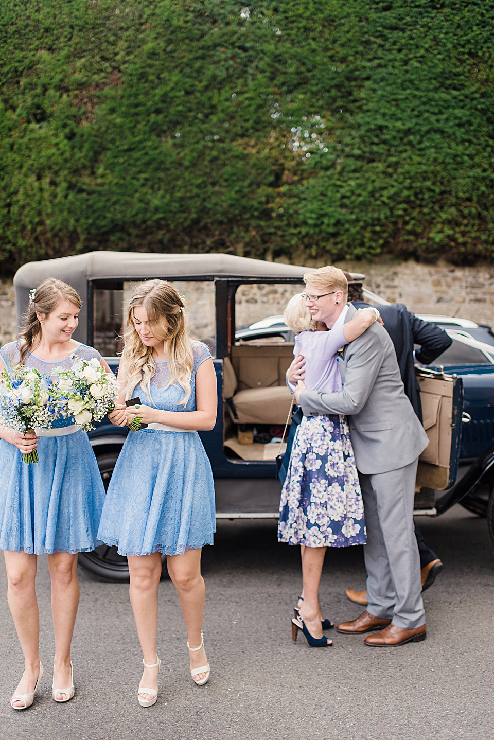 Bride Daisy wore a Stella York gown for her pale blue and flower filled Summer wedding in the English countryside. Photography by Faye Cornhill.