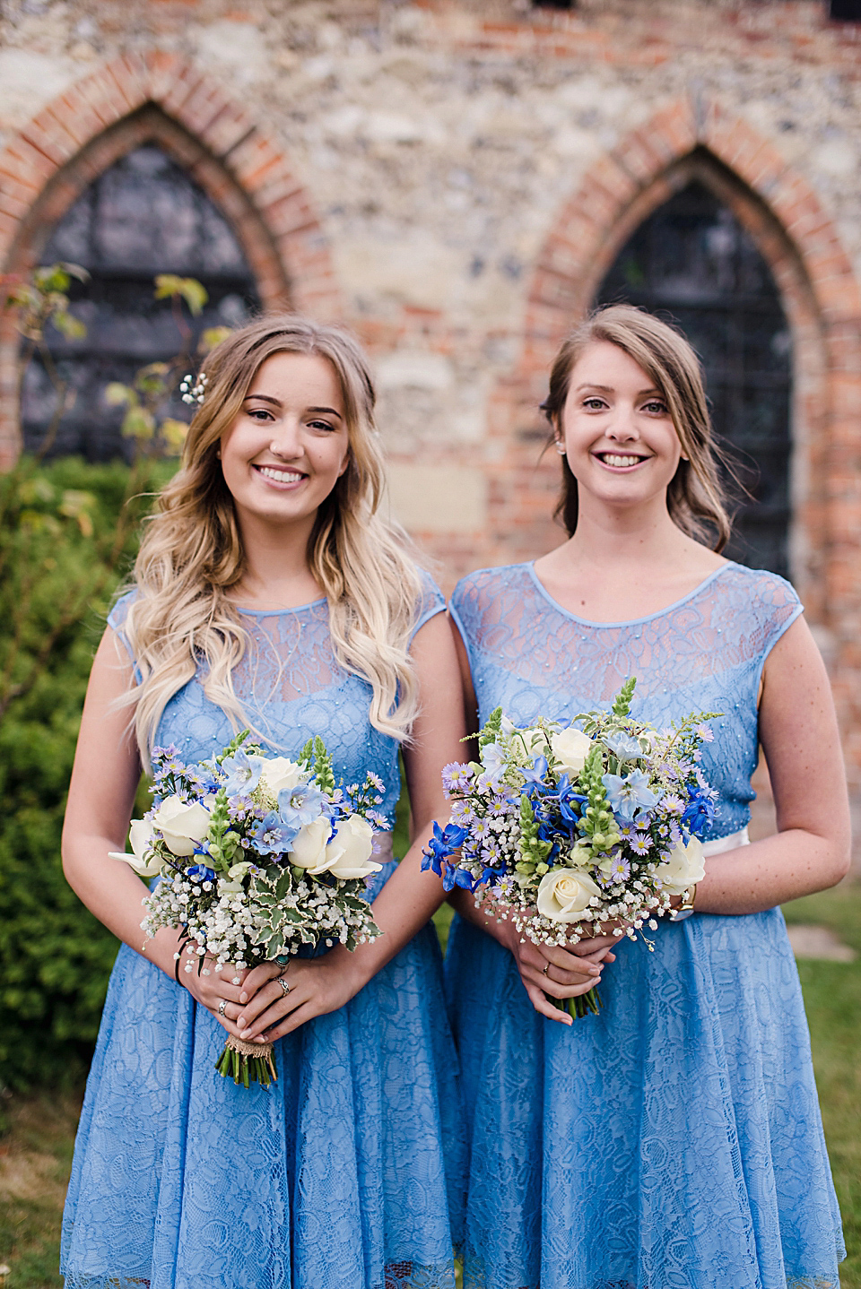 Bride Daisy wore a Stella York gown for her pale blue and flower filled Summer wedding in the English countryside. Photography by Faye Cornhill.