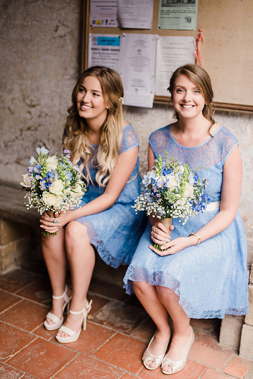 Bride Daisy wore a Stella York gown for her pale blue and flower filled Summer wedding in the English countryside. Photography by Faye Cornhill.