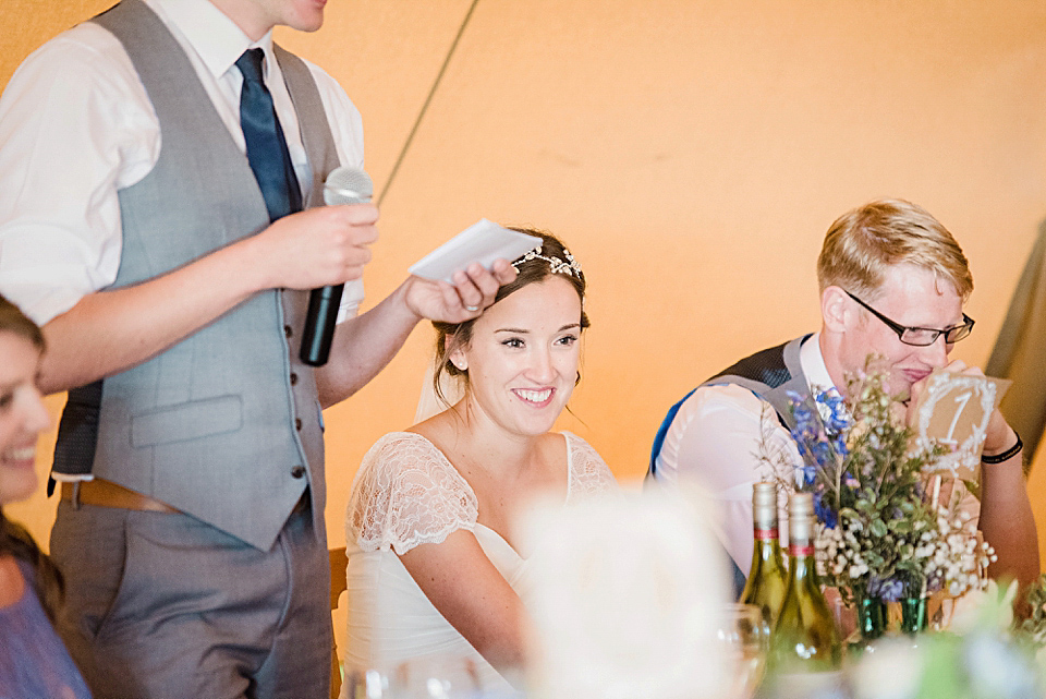 Bride Daisy wore a Stella York gown for her pale blue and flower filled Summer wedding in the English countryside. Photography by Faye Cornhill.